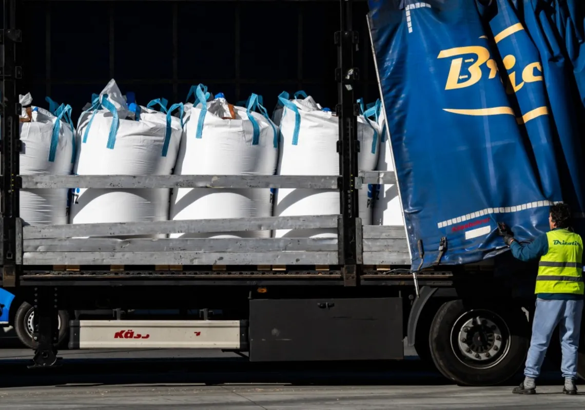 A truck is loaded with bulk bags containing fertiliser at the SKW Piesteritz agro-chemical plant in Piesteritz near Wittenberg, northern Germany, on 9 April 2026.