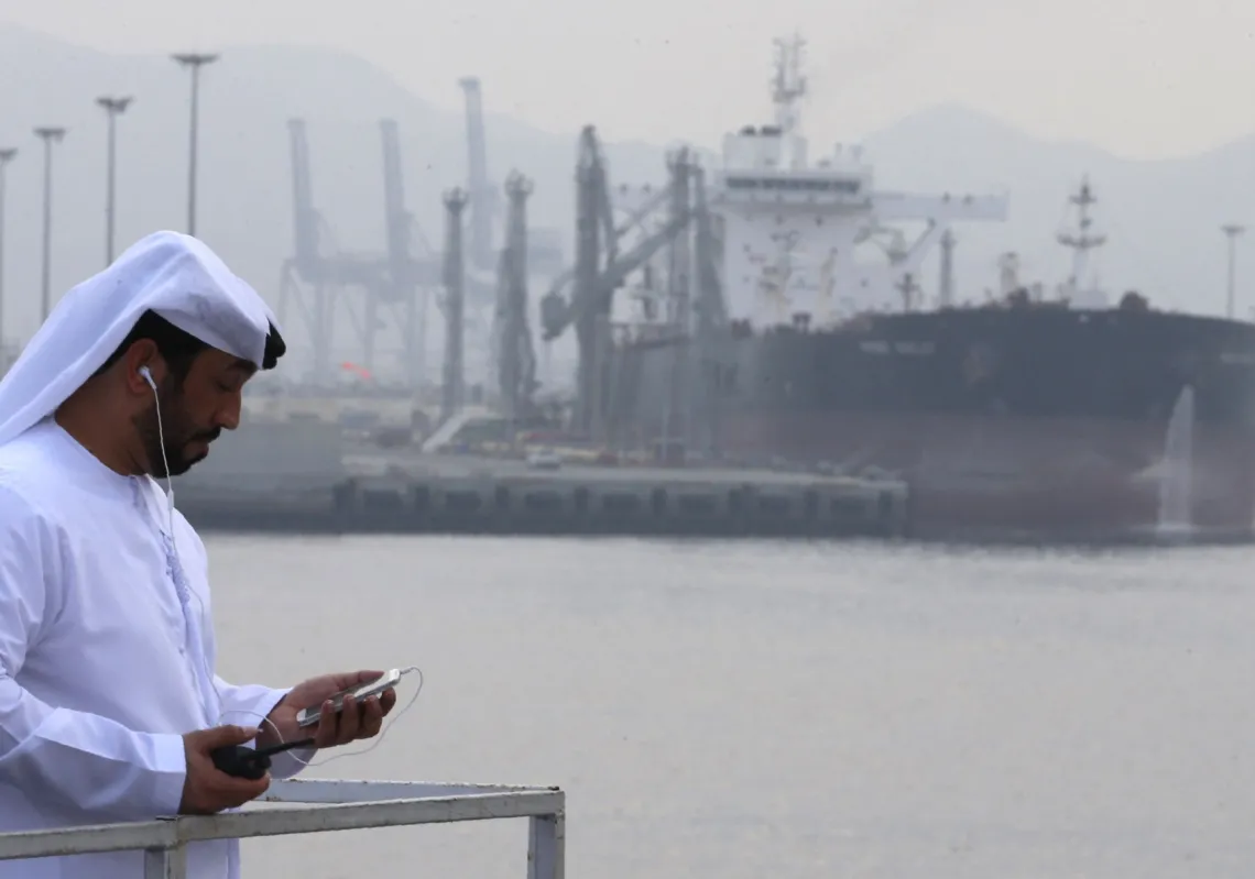 An Emirati man stands at the oil terminal of Fujairah during the inauguration ceremony of a dock for supertankers on 21 September 2016.