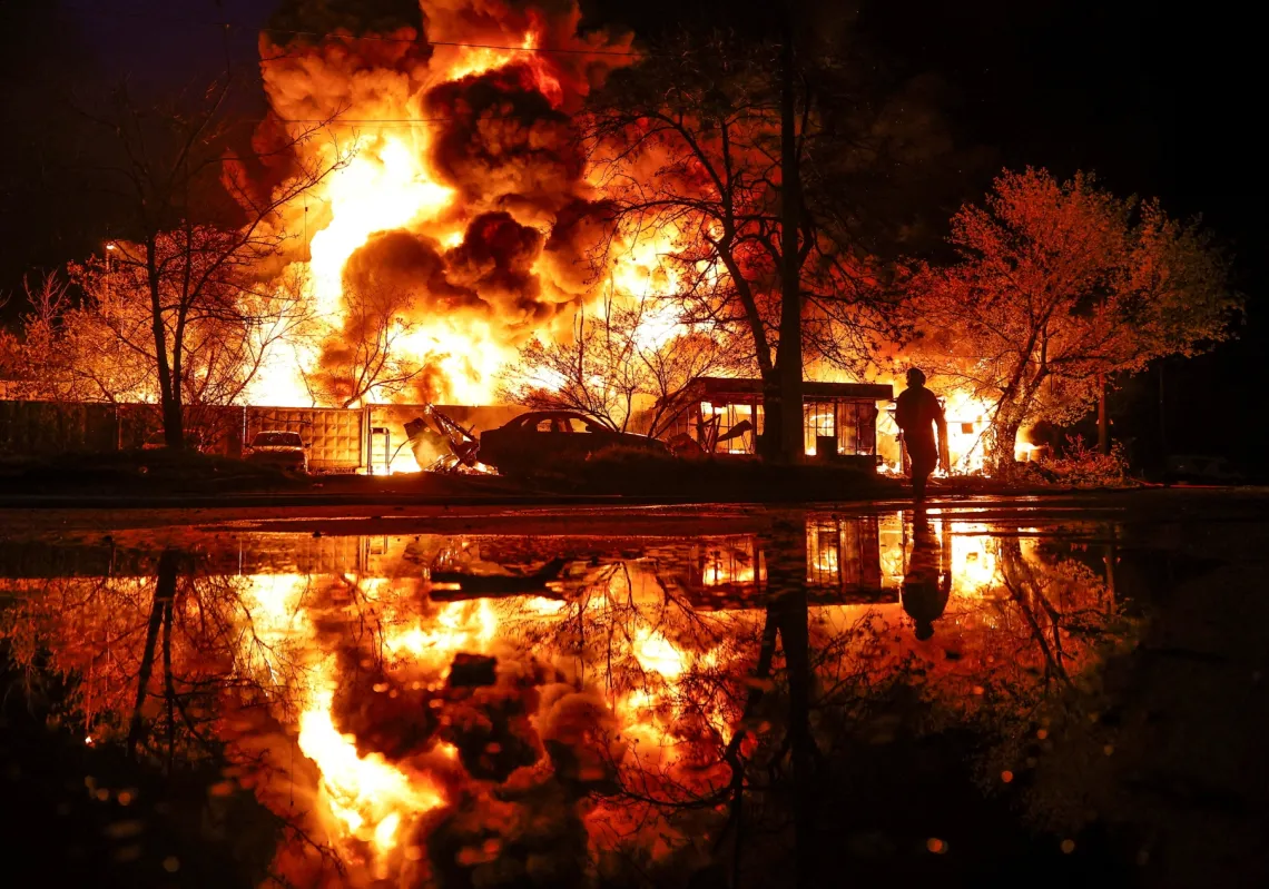 A firefighter works at the site of a recyclable materials warehouse hit by a Russian missile strike, amid Russia's attack on Ukraine, in Kyiv, Ukraine, on 16 April 2026. 