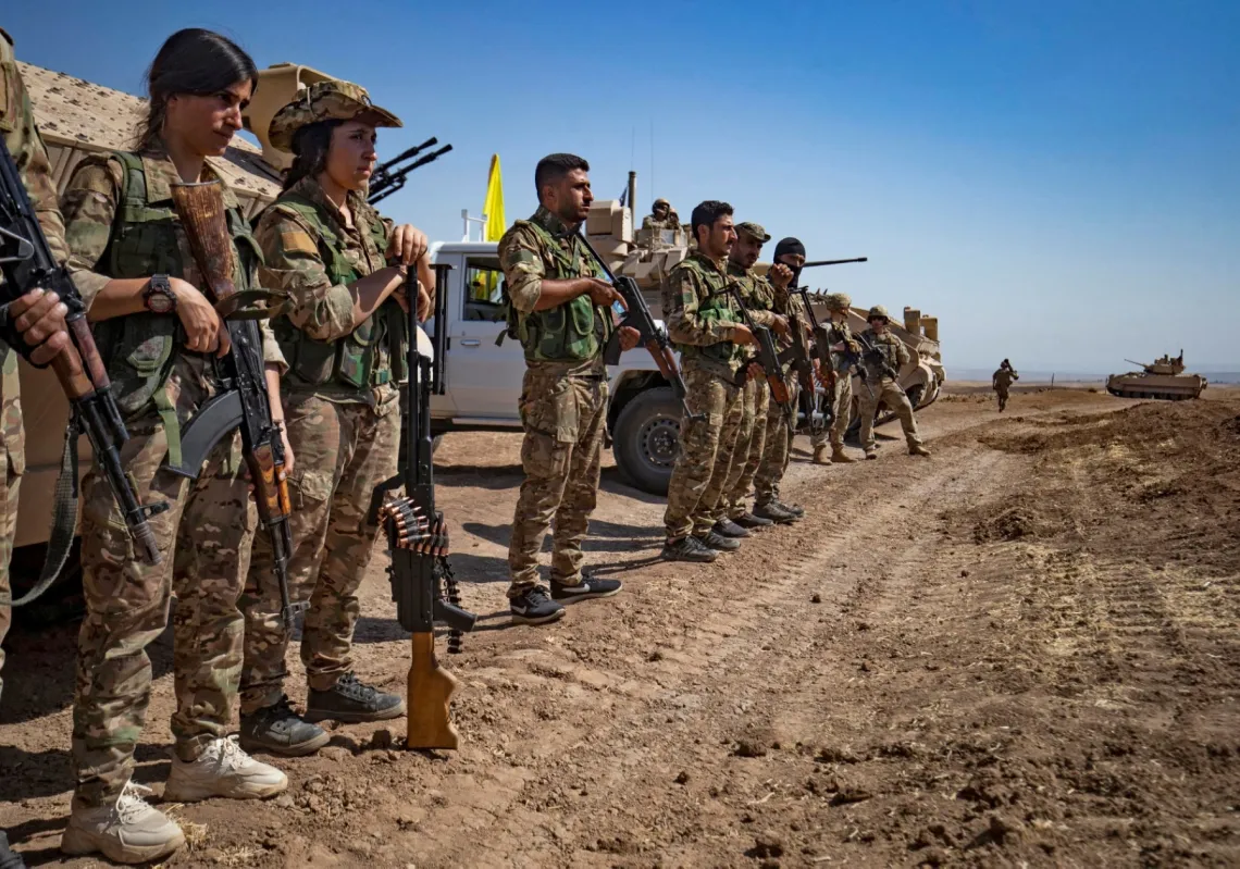 SDF forces participate in a joint military exercise with the US-led Operation Inherent Resolve coalition against the Islamic State (IS) in Syria's northeastern Hasakah province on 7 September 2022.