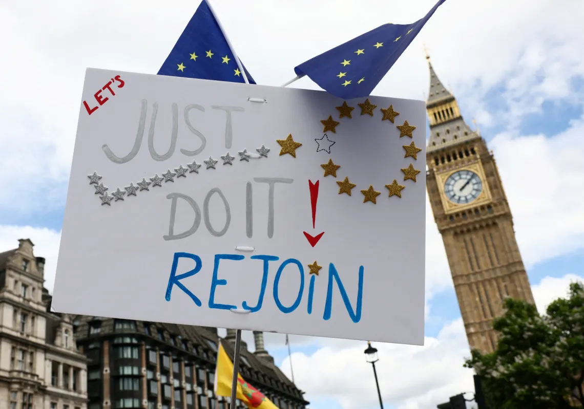 A placard is held at a protest marking ten years since Britain voted to leave the European Union in 2016 and calling for closer cooperation between Britain and Europe, in London, Britain, 20 June 2026.
