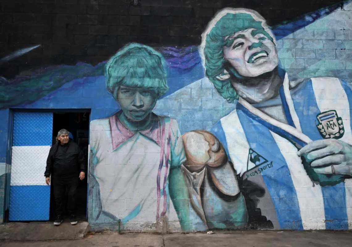 A childhood friend of Maradona stands at "El Potrero de D10S" field in Villa Fiorito, outside of Buenos Aires, on 13 June 2026, where the football legend took his first steps playing soccer at his childhood club, Estrella Roja.
