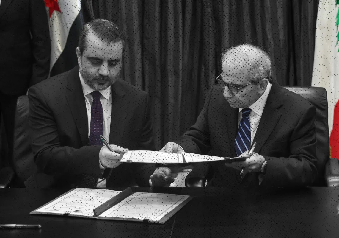 Lebanon's Prime Minister Nawaf Salam and Syria's Foreign Minister Asaad Hassan Al-Shaibani hold a document on the formation of a joint Syrian-Lebanese committee as they meet in Beirut, Lebanon, July 2, 2026. 