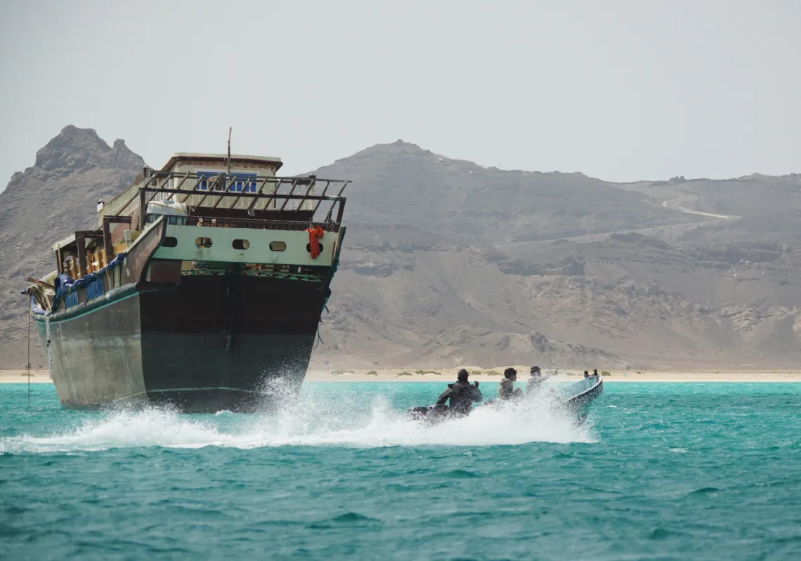 Yemeni fishermen pass alongside a commercial vessel in the strategic Bab al-Mandab Strait, Yemen, on 5 April 2026.
 
