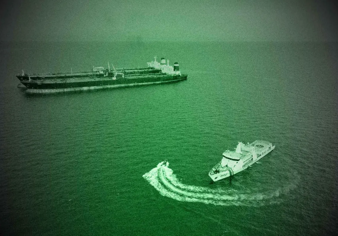 An Iranian-flagged vessel MT Arman 114 (top L, in front) beside the Cameroon-flagged ship MT S Tinos conducting a suspected illegal transhipment in the waters of Indonesia's exclusive economic zone in the Natuna Sea on 7 July, 2023.