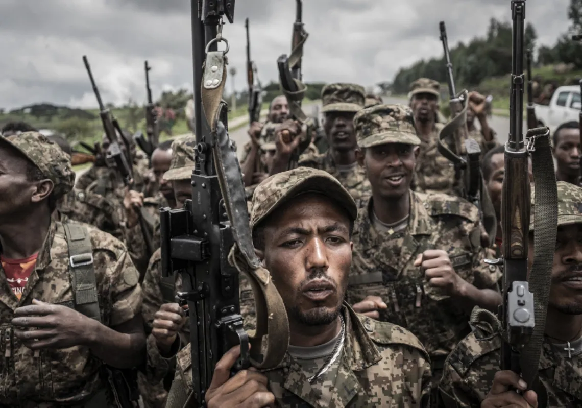 Soldiers from the Ethiopian National Defence Force chant slogans after completing their training at an officers' training ground 70 kilometres northeast of the city of Gondar, Ethiopia, on 14 September 2021.