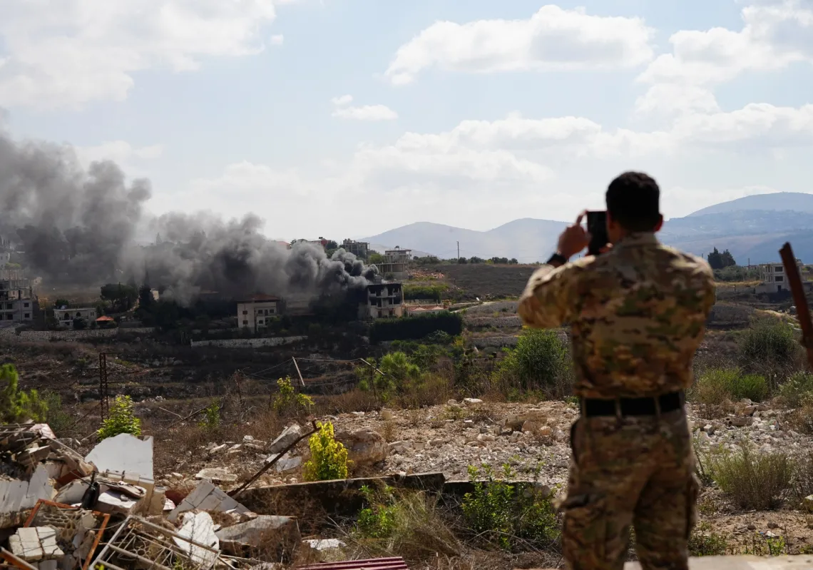 A Lebanese soldier films a house in south Lebanon destroyed by Israel on 22 September 2026.