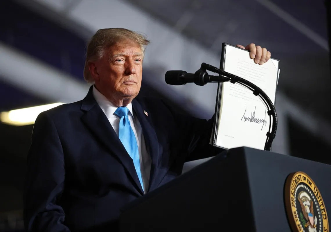 US President Donald Trump signs an executive order to lower the cost of diesel fuel during a campaign rally at Pinnacle Bank Expo Centre on the Nebraska State Fairgrounds on 5 October 2026 in Grand Island, Nebraska.