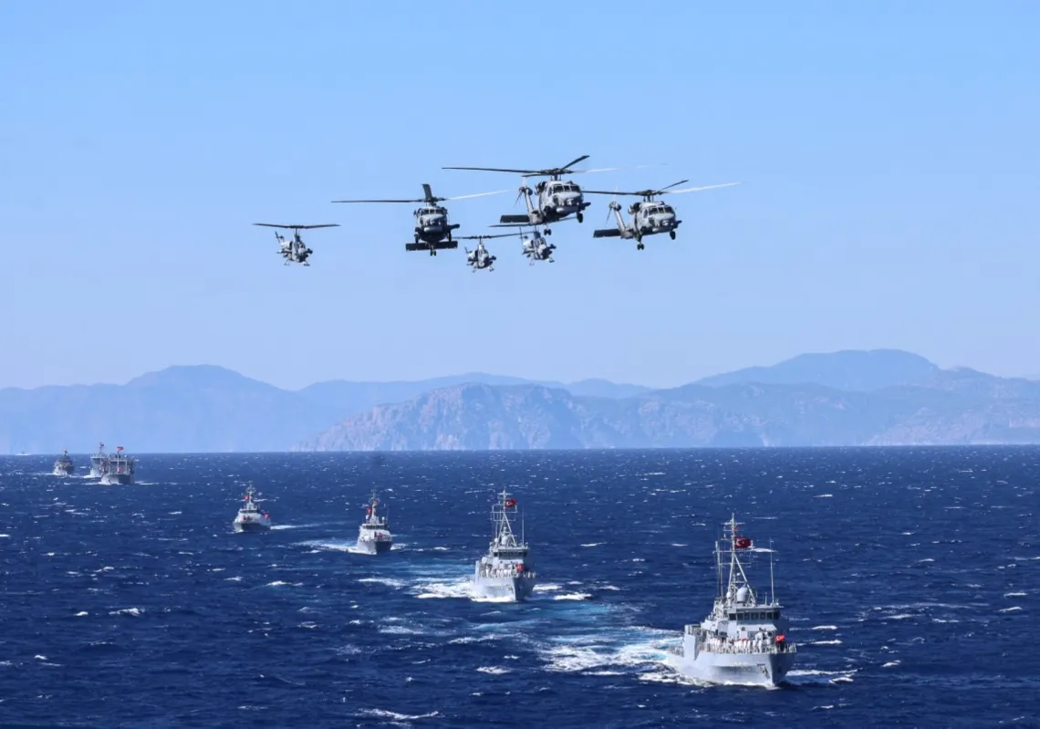 Turkish Navy's UH-60 Black Hawk (naval/S-70B variant) with T129 ATAK participate in a ceremonial parade during the Denizkurdu-I/2026 Exercise in the Eastern Mediterranean, off the coast of Aksaz, in Mugla, on 24 September 2026.
