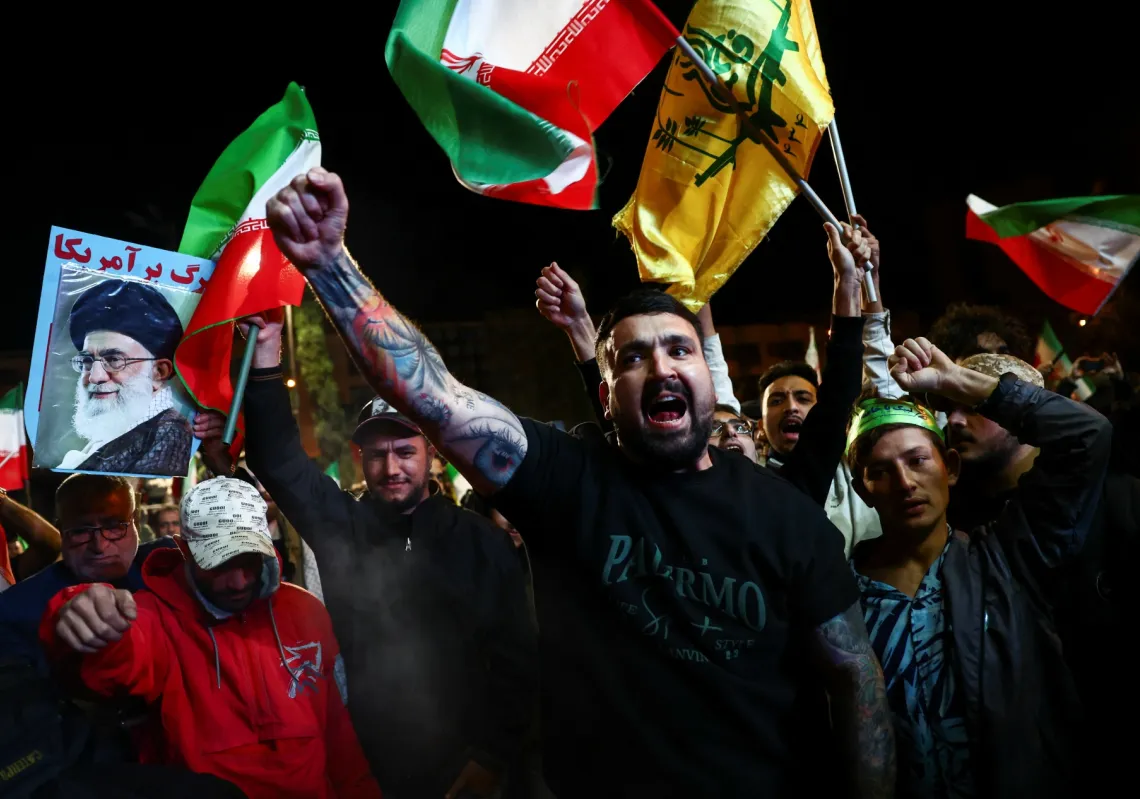 People shout slogans as they gather after a two-week ceasefire in the Iran war was announced, in Tehran, Iran, on 8 April 2026.
