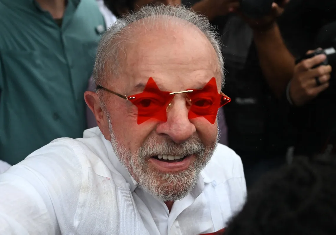 Brazil's President and Workers' Party (PT) re-election candidate Luiz Inácio Lula da Silva, greets supporters outside a polling station during the presidential runoff election in Sao Paulo on 25 October 2026.