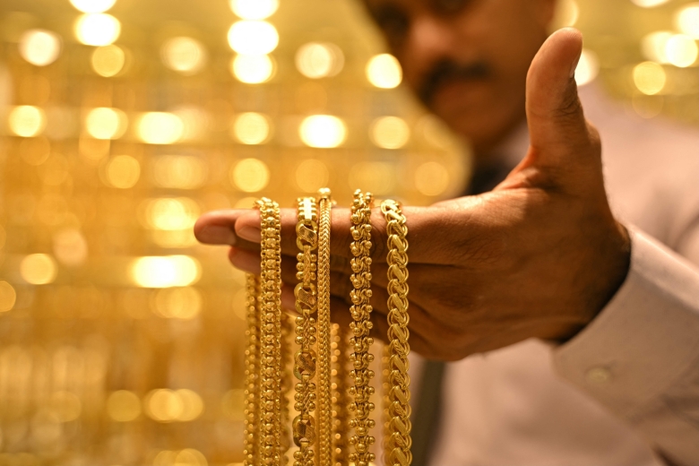 Gold hits record high of $5,100 as traders seek safety