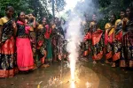 Women celebrate Diwali by lighting firecrackers at a school hostel in Chennai on October 19, 2025.  Satish BABU / AFP